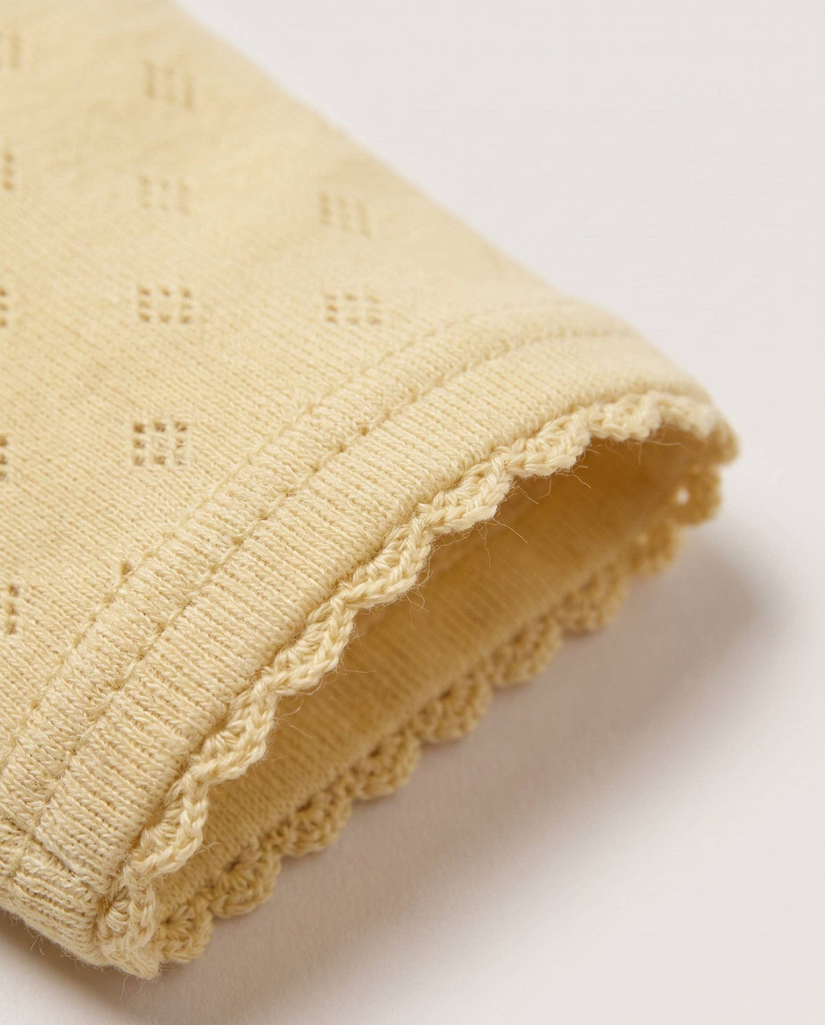 Woolen romper, long sleeves, pointelle - merino wool - Dusty Yellow: 50