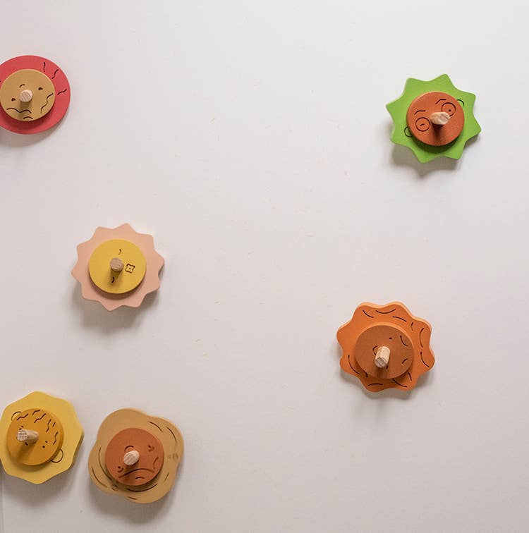 Wooden Spinning top. Elements. Stormy