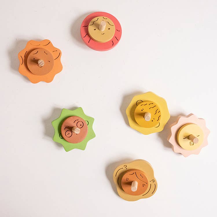 Wooden Spinning top. Elements. Stormy