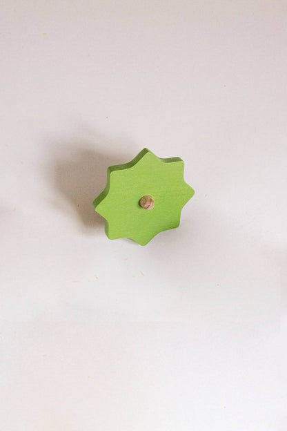Wooden Spinning top. Elements. Stormy