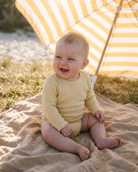 Woolen romper, long sleeves, pointelle - merino wool - Dusty Yellow: 62